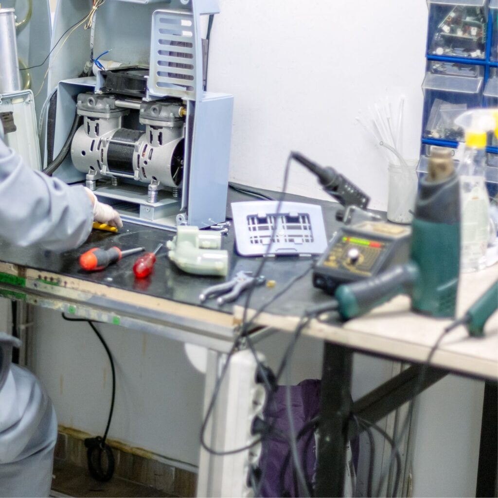 Professional medical equipment repair technician servicing hospital monitoring devices, Expert medical equipment repair workshop with diagnostic tools and replacement parts, Before and after medical equipment repair showing professional restoration quality, Certified biomedical technician performing medical equipment repair calibration testing